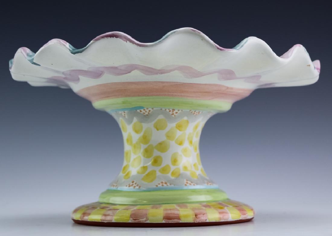 MacKenzie Childs Cayuga Art Pottery Cake Pie Plate: MacKenzie-Childs hand painted footed cake stand. Guaranteed Authentic. Features the Cayuga pattern with ruffled edge and wide base. Hand decorated with polychrome glaze. Impressed mark on base. Measur