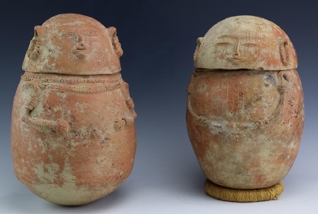 Pre-Columbian Chimila Anthropomorphic Burial Urns: Pair of pre-Columbian burial Urns. Thought to originate from the Northern Colombian, Chimila / Tairona cultures, c. 1000-1500. The urns are similar buff-slip covered reddish ceramic of oblong anthropo