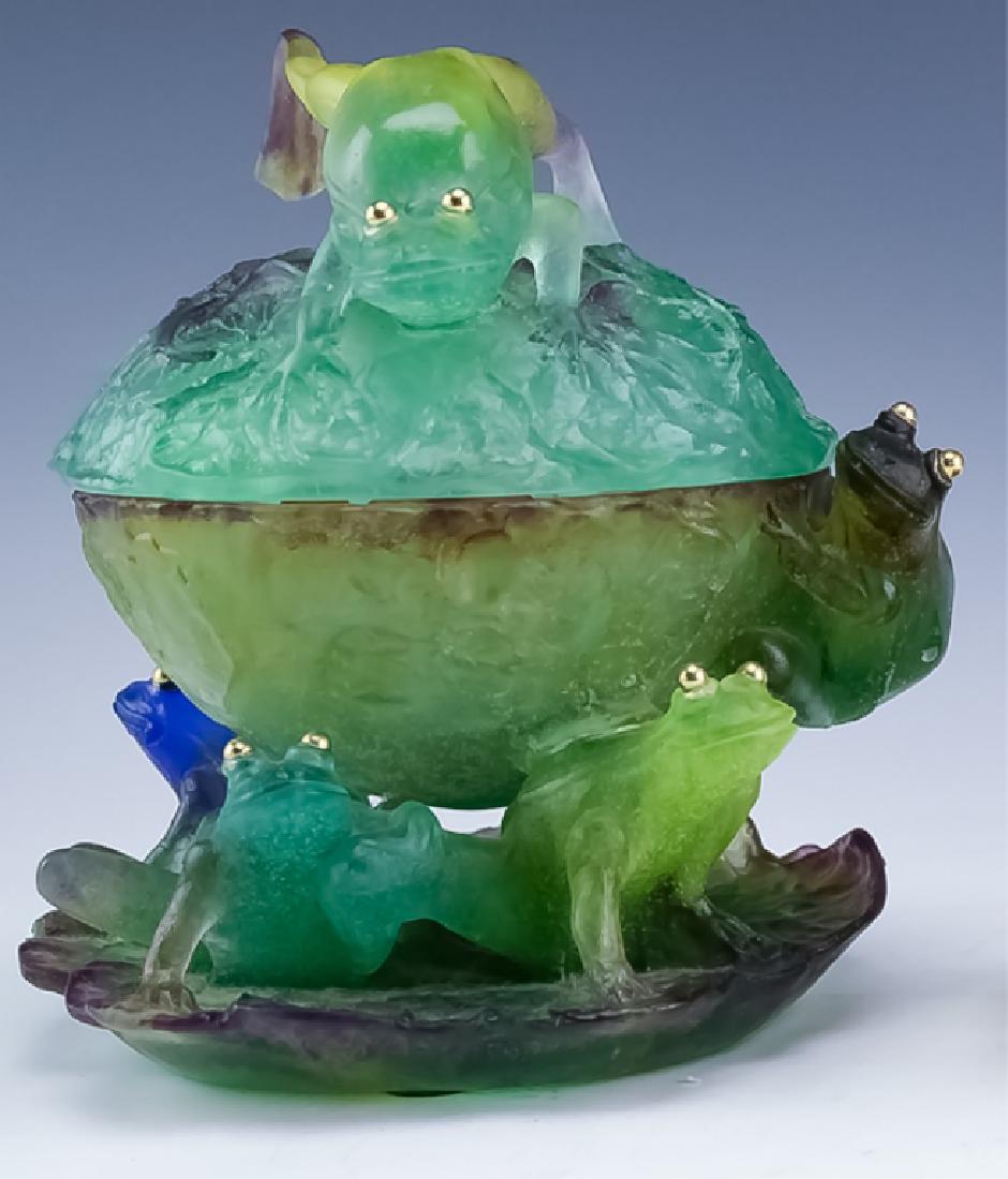 Daum France Pate De Verre Lidded Frog Bowl Box: Daum French art glass lidded bowl. Figure features a form consisting of numerous golden eyed frogs with a lily pad form fixed base and frog form handle on the lid. Signed Daum France. Measures 8 1/2" 