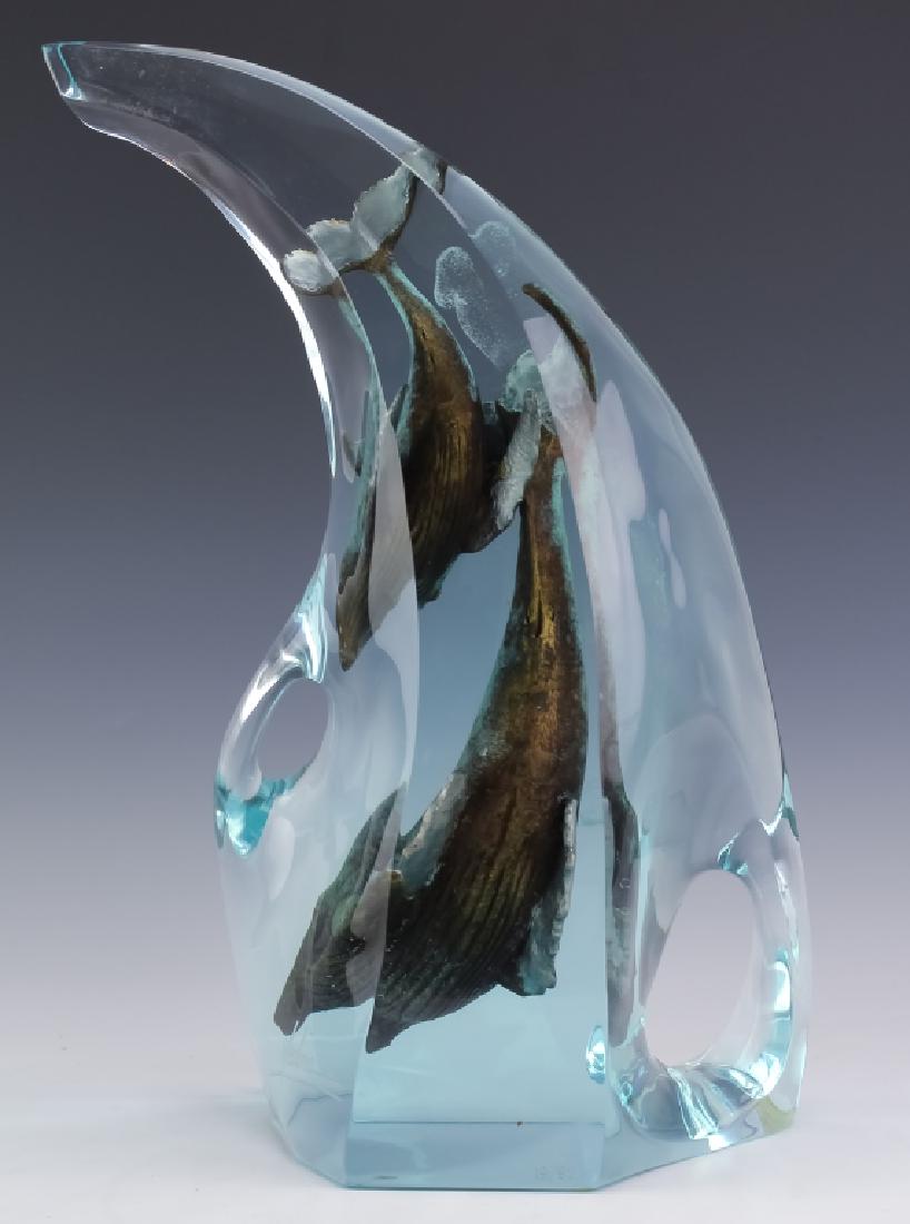 Dan Medina Studio Art Figural LE Whales Sculpture: Signed and numbered limited edition figure by Dan Medina (20th Century American) Artwork depicts two whales performing a beautiful ballet beneath the waves. Crafted of cast bronze encased in Lucite. A