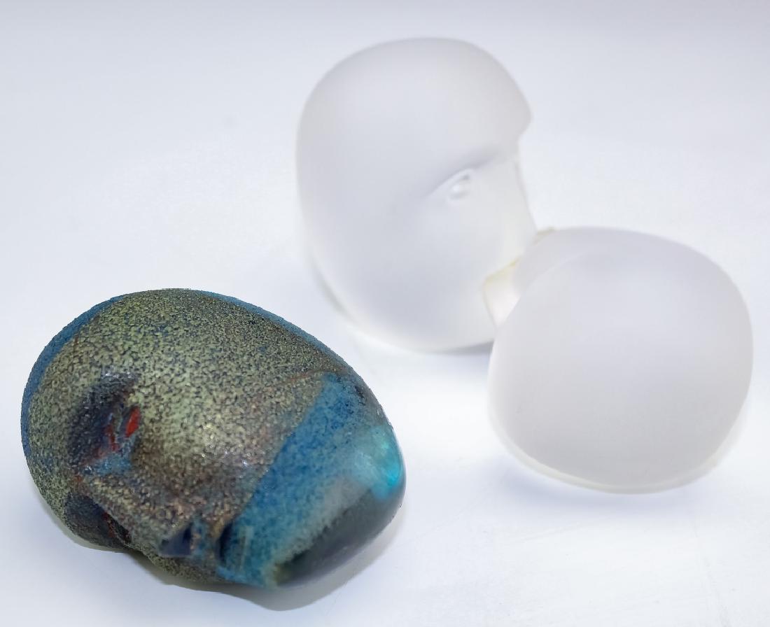 Kosta Boda Bertil Vallien Art Glass Head Sculpture: Two art glass paperweight sculpture by Bertil Vallien for Kosta. Crafted of fine quality art glass. Kissing sculpture in frosted glass measures 5" x 3" Double is in Poor condition with repaired crack