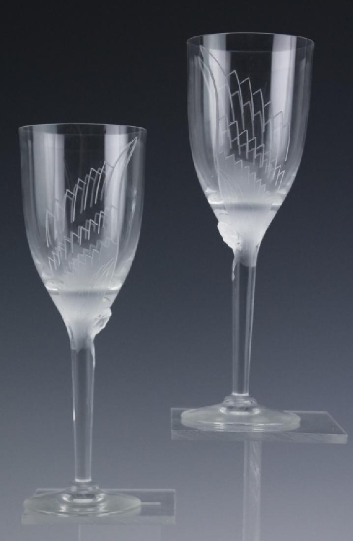 Lalique French Crystal Glass Angel (2) Wine Goblet: Pair of champagne flue glasses by Lalique. Crafted of fine quality French art glass crystal. Signed Lalique France. Each measures 8 1/8" x 2 3/4" Good condition with no issues. Provenance: Private Pal