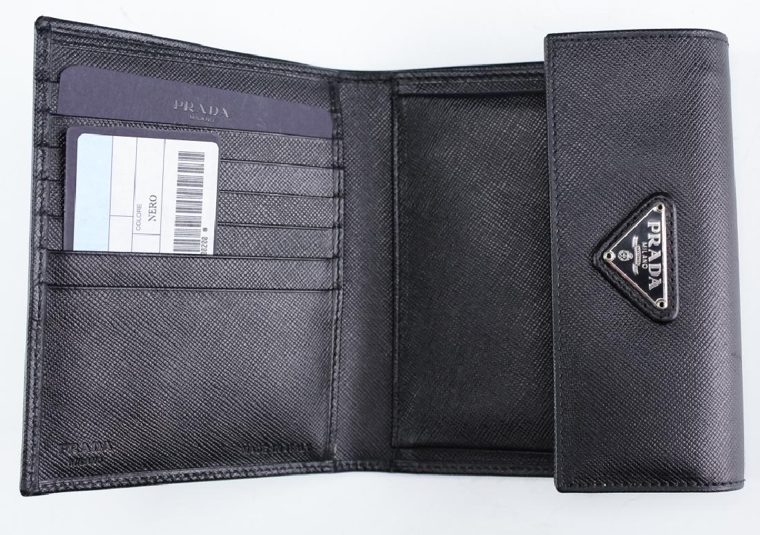 Authentic Prada Italian Leather Document Wallet: New, in box, Prada Italian leather wallet. Features a tri-fold document holder. Opens to reveal places for credit cards, coins, and cash as well as pockets for other items. Measures 5 1/8" x 4 1/4". C