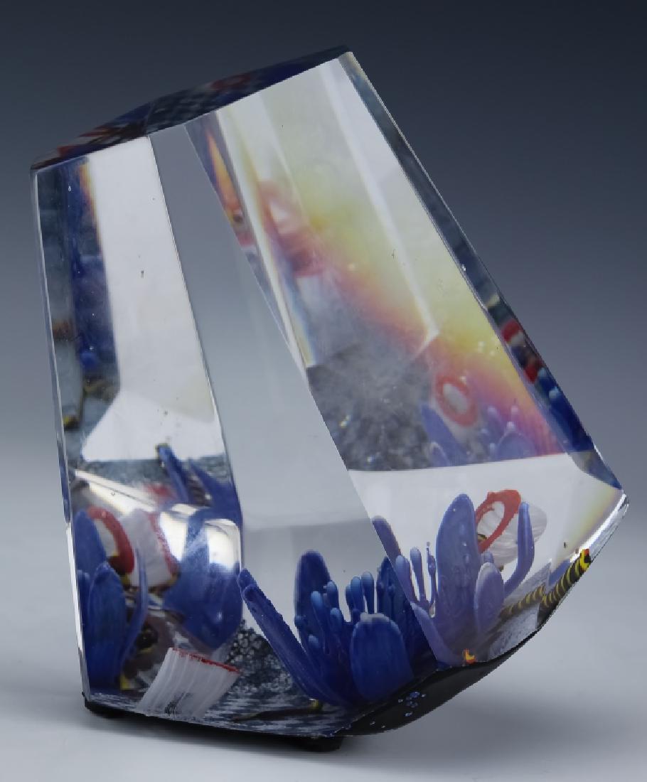 American Studio Art Glass Sea Aquarium Paperweight: Large studio art glass paperweight aquarium block sculpture. Sculpture features sea anemone with striped eel creatures encased in clear crystal. Facet cut sides. Unidentified artist signature on base,