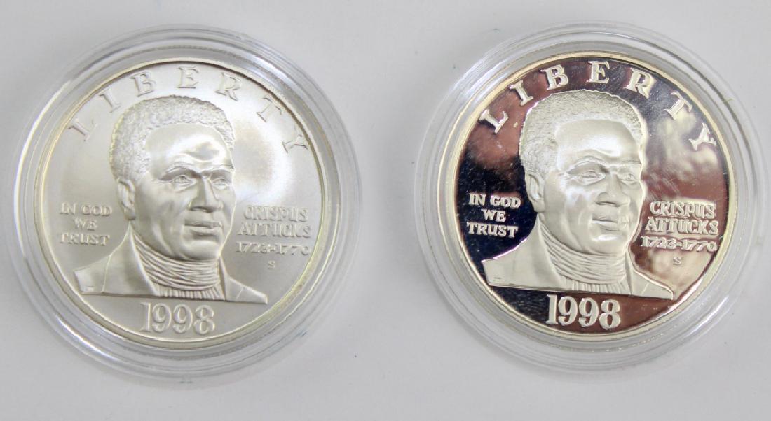 1998 Black Rev. Patriots 2pc Silver $1 Commem Set: 1998 Black Revolutionary War Patriots commemorative proof coin set. Comes with a proof and uncirculated version of this silver $1 dollar coin. Comes in original government packaging. Good overall cond