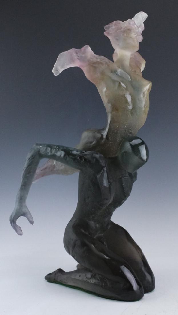 Daum Pate De Verre L/E Sculpture Of Dancing Couple: Daum French crystal art glass sculpture. Depicting a man holding a woman over his head. The man is crafted of gray-blue frosted glass with the woman a light purple / pink with clear areas. Measures 18