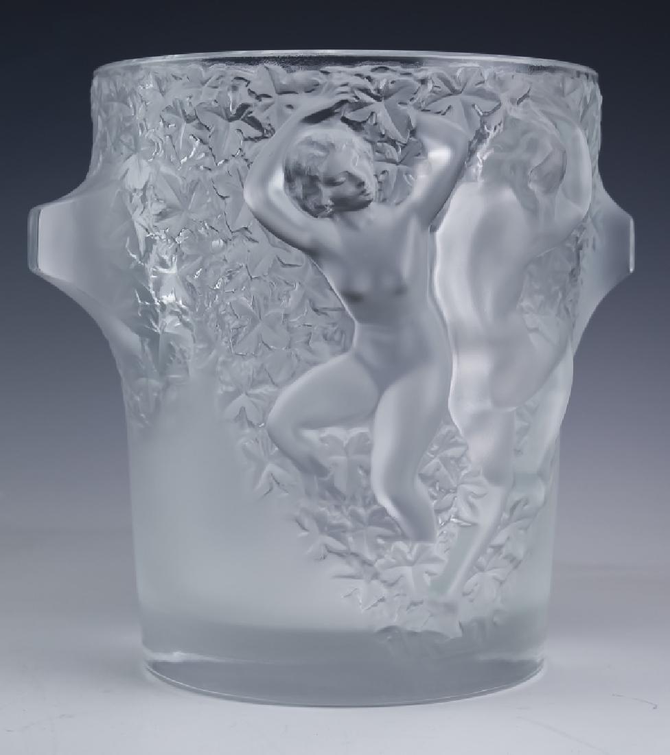 LALIQUE Crystal Nude Ganymede Champagne Ice Bucket: Lalique French crystal, art glass wine cooler ice bucket, vase. Guaranteed Authentic. Features the form titled Ganymede. Features raised nude female figures rendered in frosted relief with floral moti