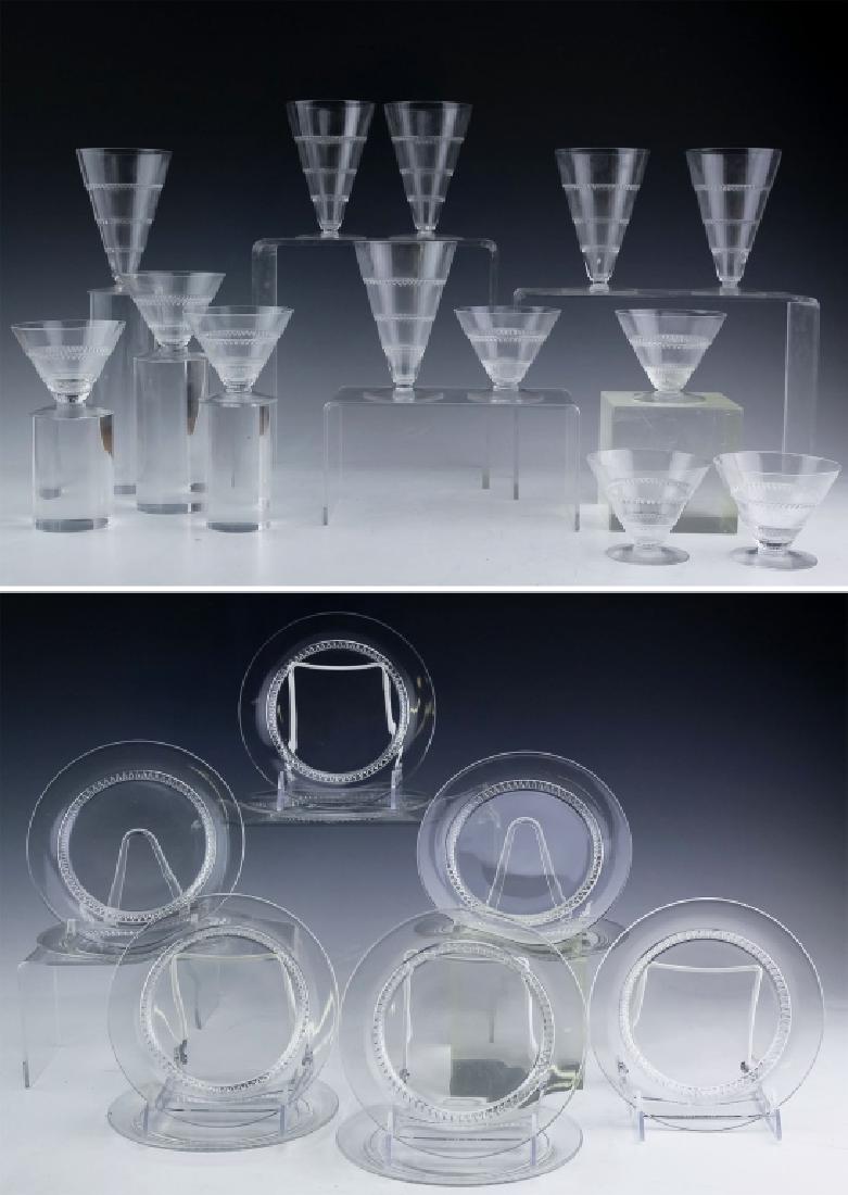 LALIQUE 24 Vouvray French Crystal Plate Wine Glass: Lot of twenty four pieces by Lalique. Crafted of fine quality French art glass crystal. Features the hard to find Vouvray pattern. Lot consists of 7 wine or juice glasses 6 cordial or liquor glasses a