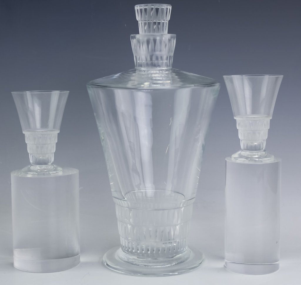 Lalique French Art Glass VOUVRAY Decanter Glasses: Four piece decanter and shot glass set by Lalique. Crafted of fine quality French art glass crystal. Features the Vouvray pattern with art deco Egyptian influenced design. Set includes the decanter wi