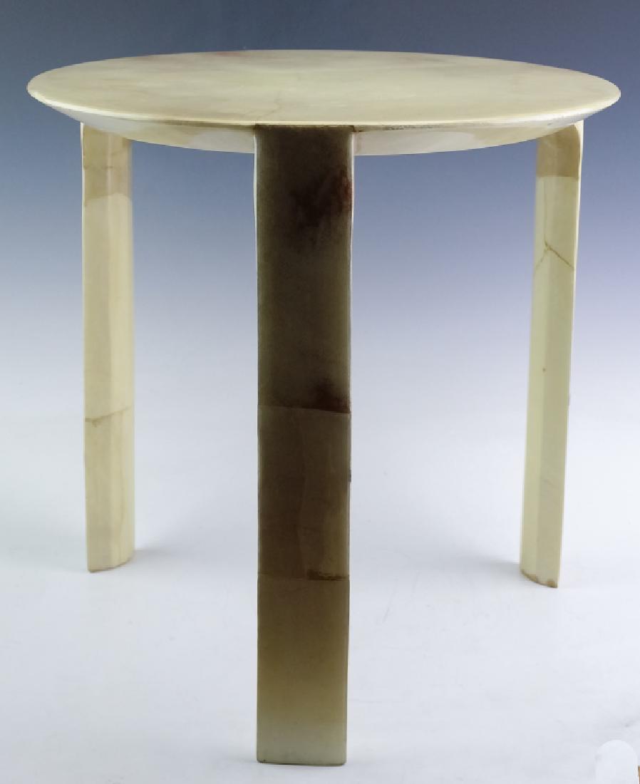Enrique Garcel Jimeco Goatskin Occasional Table: Enrique Garcel, Jimeco goatskin circular side table. Features a cream goatskin under thick lacquer. Retains label on base. Measures 18" x 18". Good overall condition with some craquelure or crazing to