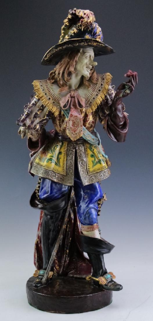 Capodimonte Italian Naples 31" Porcelain Musketeer: Super fine quality Capodimonte musketeer sculpture. Features the elaborately decorated form of a man in colorful drapery embellished with gold. Comes with original gold foil label. Measures 31" x 11"
