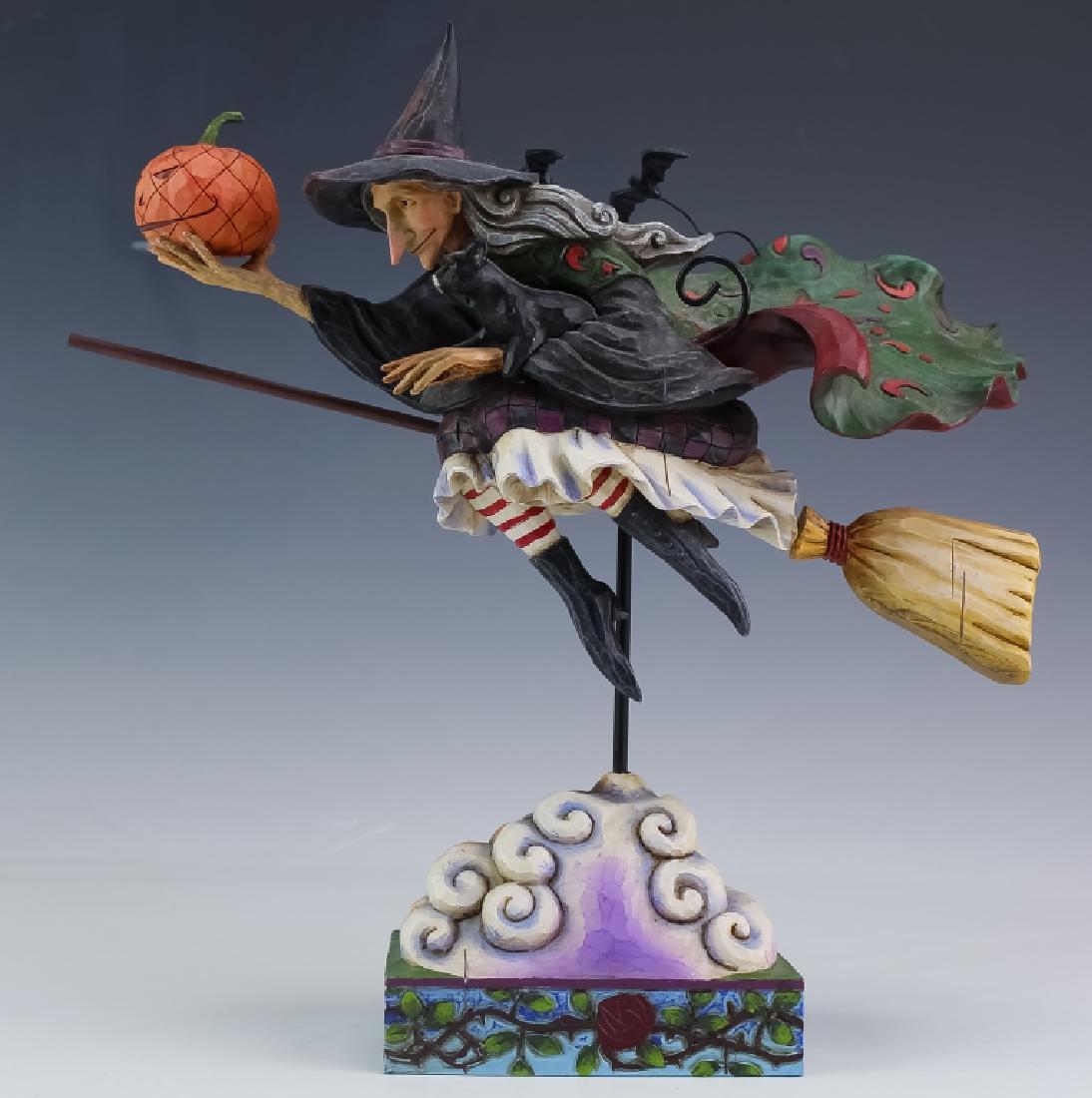 VTG Whimsical Jim Shore Halloween Witch Sculpture: Jim Shore sculptural figurine. Features the form title "Fly With Me For A Spell". Crafted of polychrome decorated resin. Measures 11" x 11" x 4". Marked on base. Good overall condition with minor wear