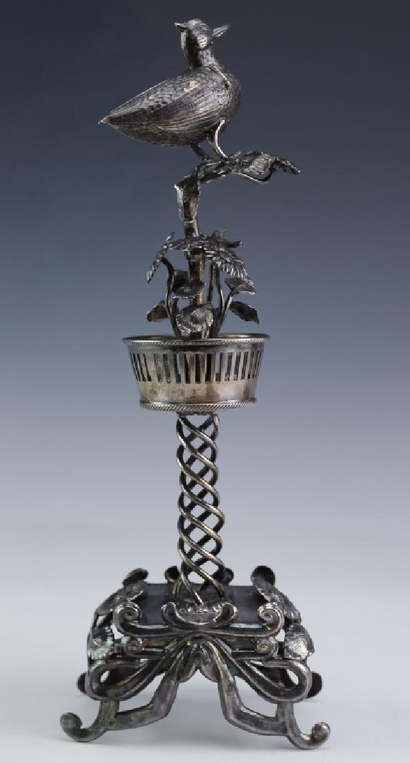 Antique Judaica Figural Floral Bird Spice Tower: Old Judaica silver plated flower and bird ornate spice tower. Features a four claw foot base with flowers and leaves adorning. Having a swirl design leading up to a basket where more flowers are found