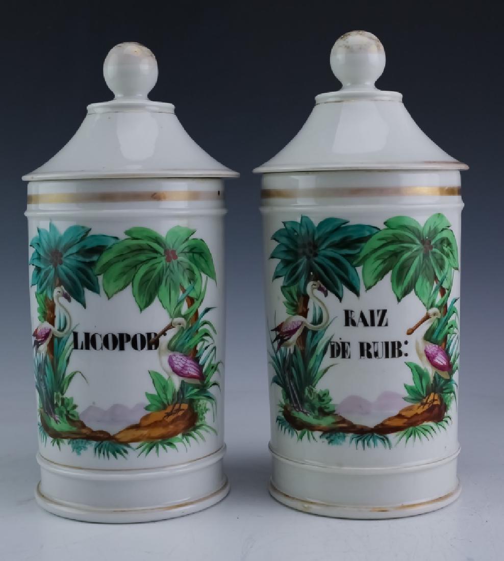 PAIR Old Paris Porcelain Flamingo Apothecary Jars: Pair of antique late 19c apothecary jars. Crafted of fine quality Old Paris porcelain. Features hand painted tropical mountain scenes of Cuba. Pink flamingo and Roseate Spoonbill birds flank the cente
