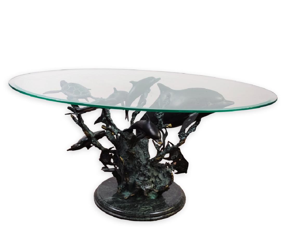 Figural Cast Bronze Dolphin Turtle Coffee Table: Cast bronze coffee or cocktail table by SPI. Features coral style base with family of dolphins, stingray, angel fish and sea turtles. Very nice deep patina with green verdigris and polished areas. Mou