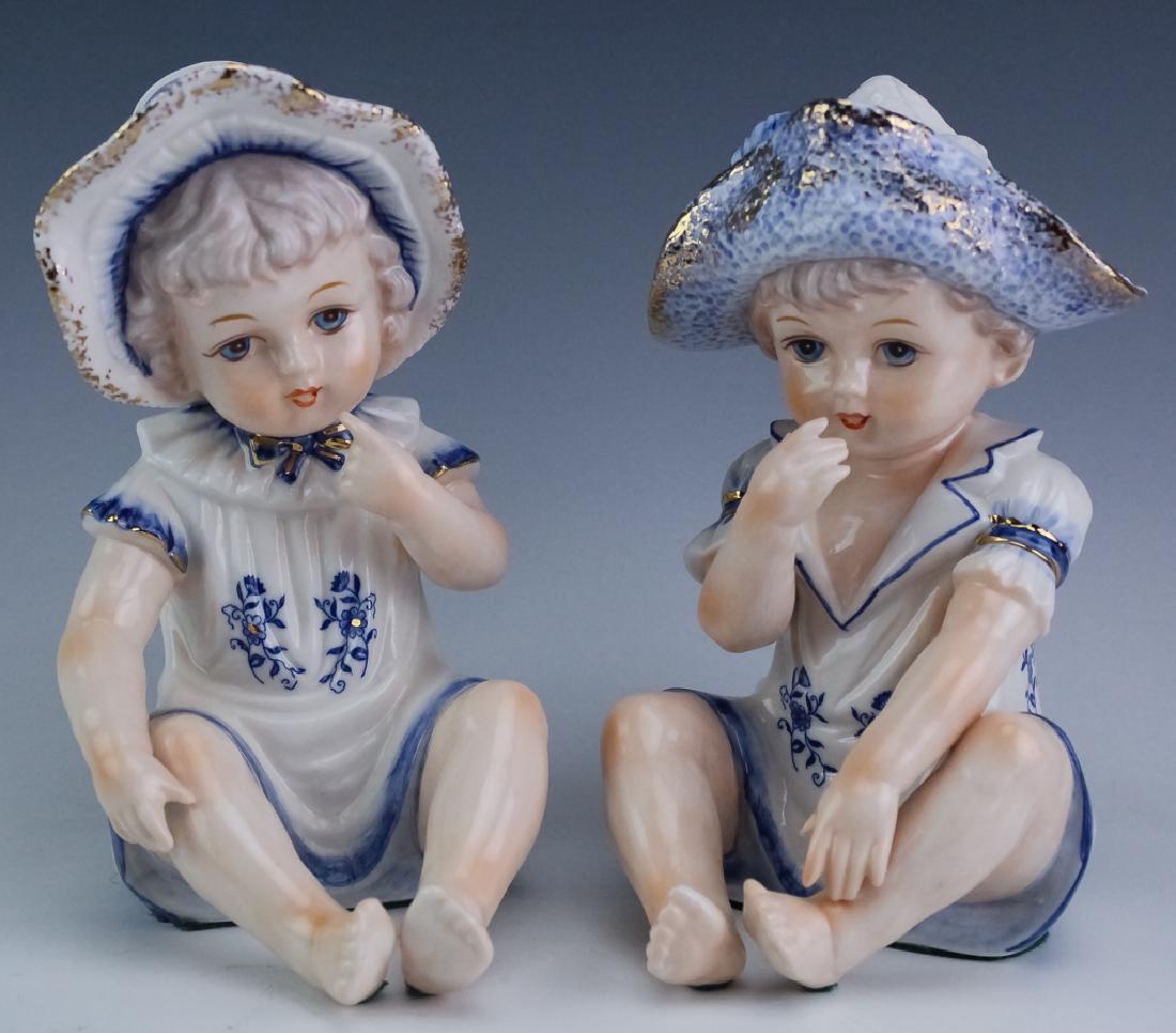 Pair Vintage Porcelain KPM Piano Babies Figurines: Pair of KPM porcelain figurines. Features the form of young children decorated with polychrome glaze. Measures 7 1/2" x 5". Good overall condition with no damage to note. In house, Hill Auction Galler