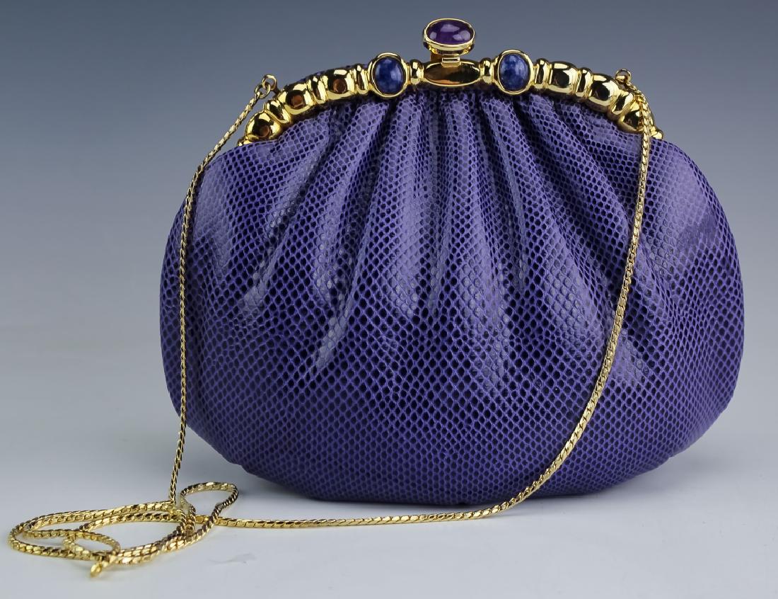 Judith Leiber Gemstone & Purple Snakeskin Handbag: Vintage Judith Leiber snakeskin bag. Features deep purple snakeskin leather gathered at the top and set in a gold plated metal, latch closure frame. The frame is embellished with natural amethyst and