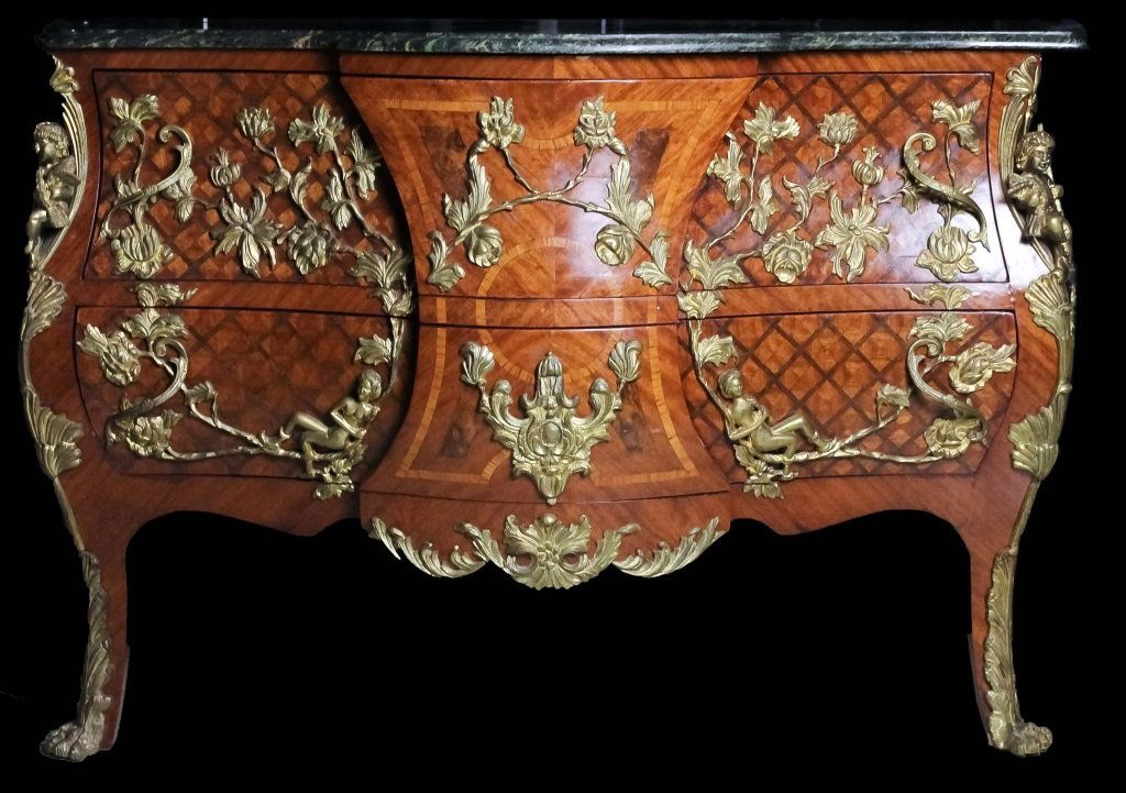 French Style Inlaid Ormolu Mounted Bombe Chest: French style inlaid bombe front brass ormolu mounted marble top two drawer chest. Satin wood lattice style inlay decorated drawers and sides. Ornate floral and acanthus mounts with full bodied cherubs