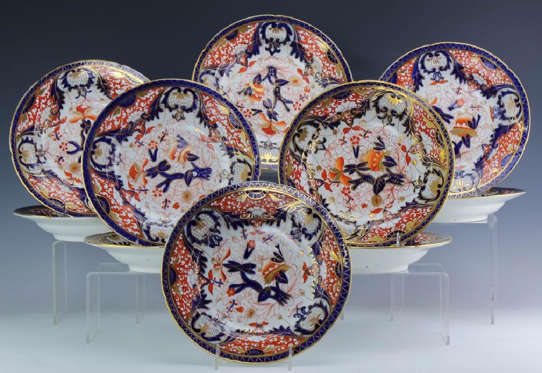 SET 10 Antique Derby Kings Pattern Rim Soup Bowls: Set of ten antique (circa 1800) rim soup bowls by Derby Porcelain. Crafted of English pottery. Decorated in the Kings pattern with cobalt blue, rust and gold in an ornate Imari floral design. Unmarked