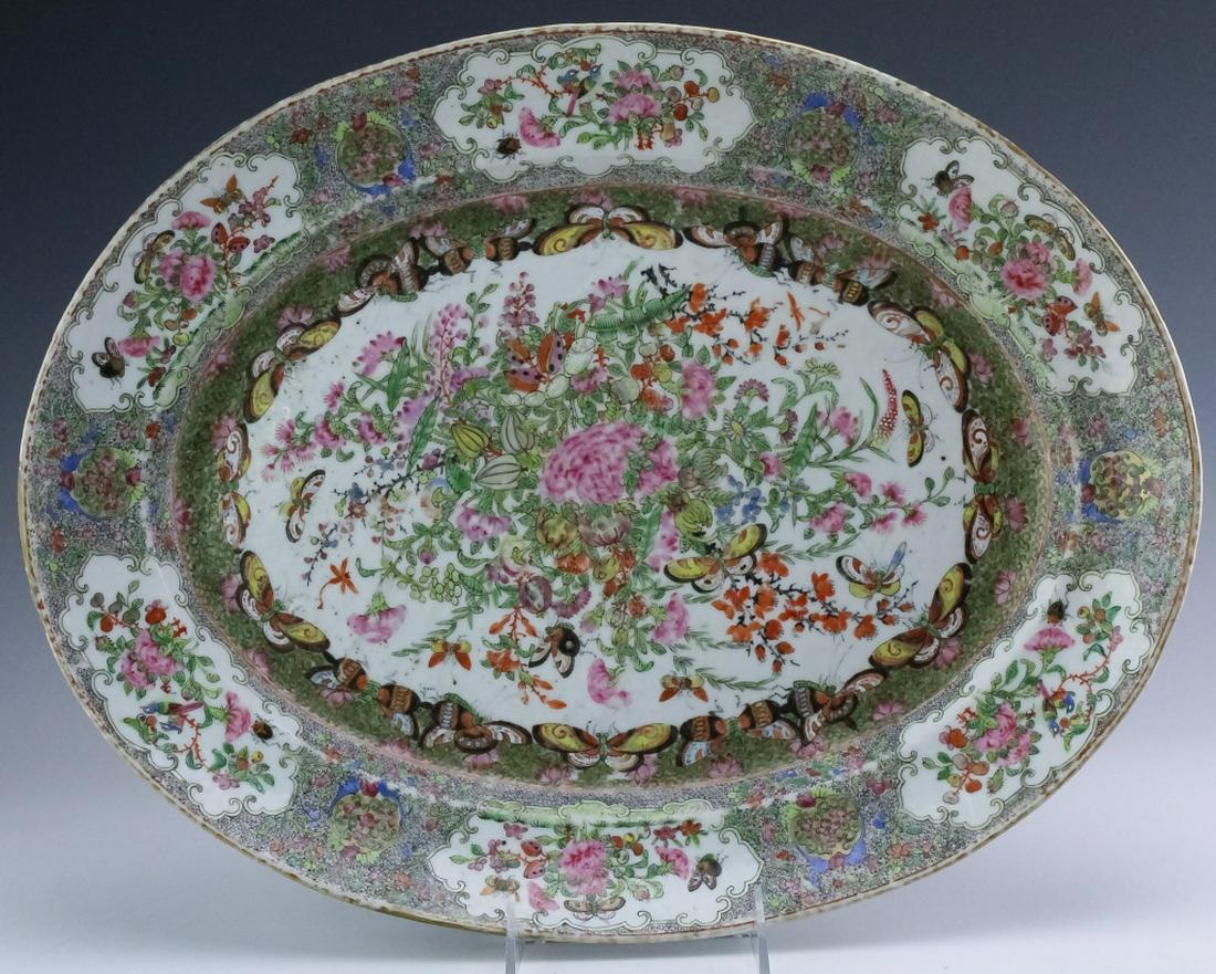 Antique 18" Chinese Famille Rose Porcelain Platter: Antique Chinese famille rose porcelain serving platter. Crafted of fine Chinese porcelain. Elaborately decorated with floral and figural motifs with butterfly, birds, and beetles. Measures 18" x 14". 