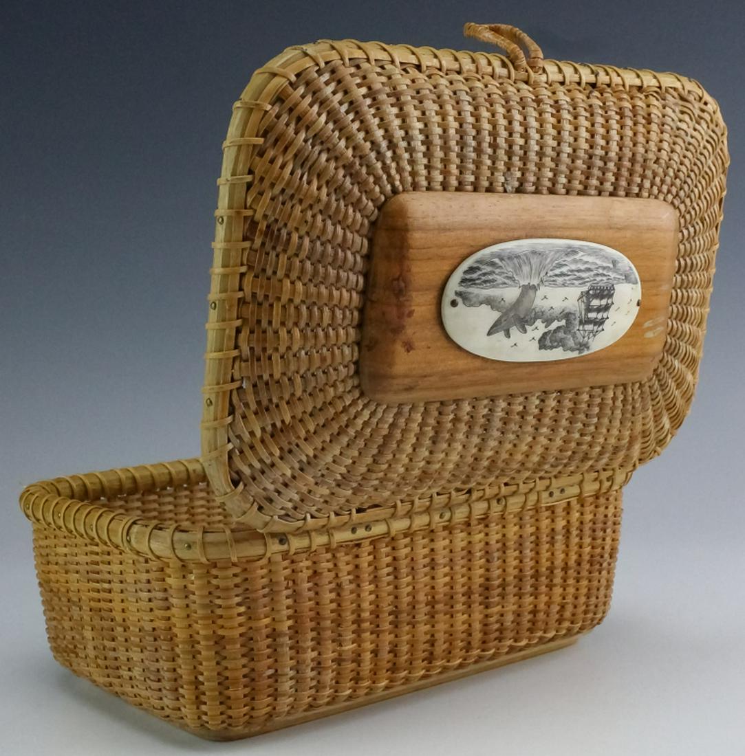 Vintage Hand Crafted Nantucket Carved Bone Basket: Vintage Nantucket basket. Features a hand woven body with ovular bone carving of a ship and whale. Measures 7 7/8" x 4". Unsigned. Good overall condition with no damage to note. Hill Auction Gallery w