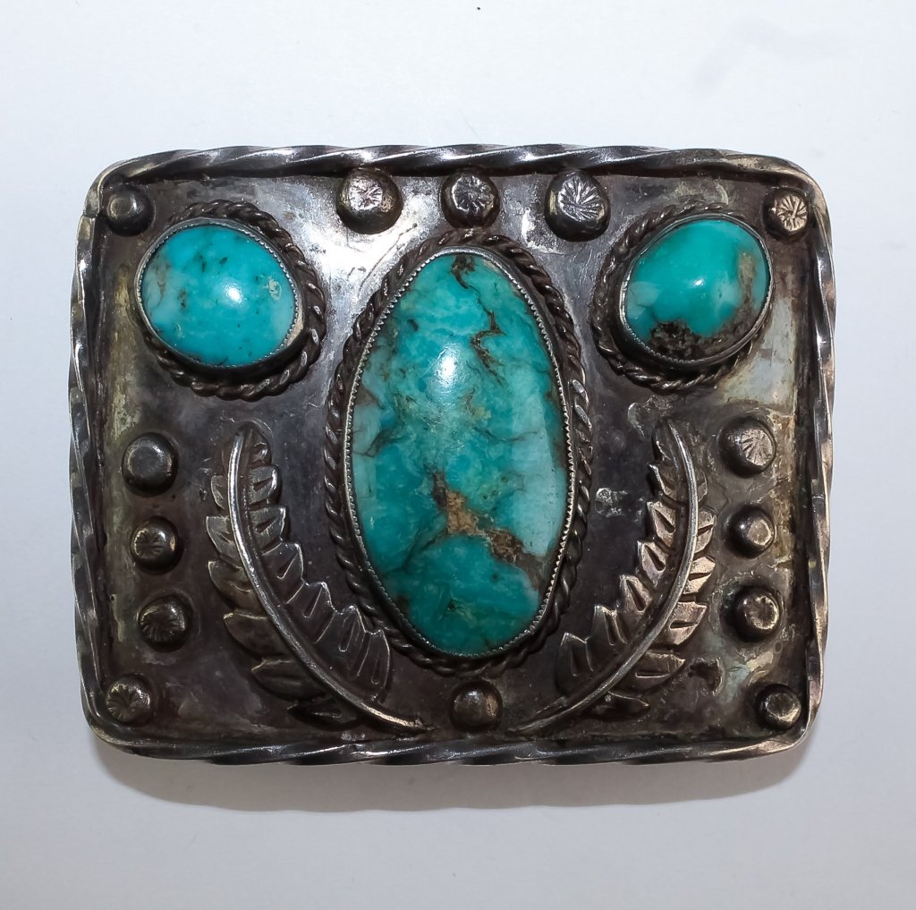 VTG Native American Navajo Turquoise Belt Buckle: Vintage Men's Native American Navajo Indian turquoise belt buckle. Features a series of three turquoise cabochons with applied and stamped beads and leaves. Unmarked but tested sterling. Measures 2 3/
