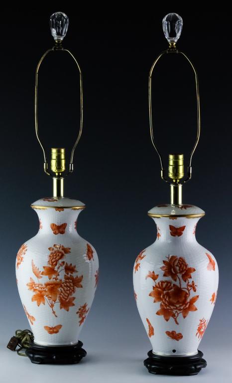 HEREND 2 Porcelain Chinese Bouquet Rust Table Lamp: Pair of Herend Hungarian porcelain table lamps. Features the pattern Chinese Bouquet in the Rust color. Features floral decoration throughout. Capped with a crystal finial. Porcelain body measures 13"