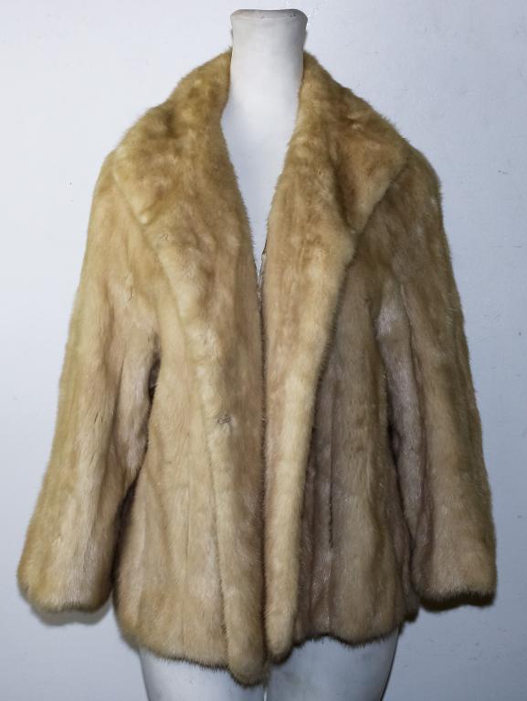 Marshall Field & Co Blonde Mink Jacket Fur Coat: Ladies waist-length blonde mink fur coat. Designed with a lapel collar, a eye front fastening, and two outer pockets. All Measurements are approximate. Coat / jacket measures approximately 48 in lengt