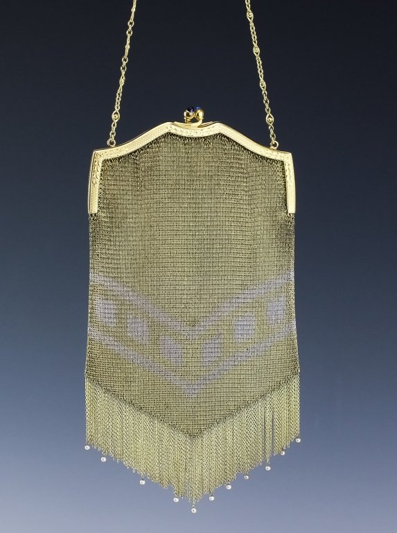 Antique Art Deco Two Tone Mesh Fringe Handbag: Antique art deco era white and yellow gold tone metal mesh purse. Features gold plated mesh with white gold tone pattern near the beaded fringe at the bottom. Comes with a chain with 7" drop. Measures
