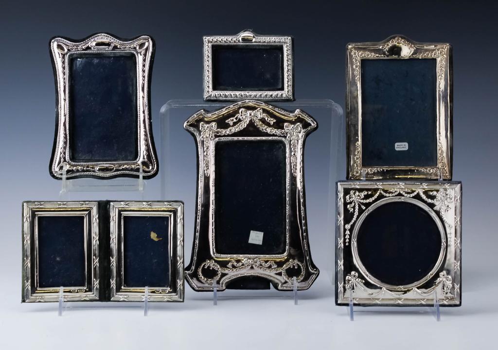 Lot of 6 Sterling Silver Photo Picture Frames 925: Collection of English sterling silver picture frames. Features silver over a velvet lined body with various designs with three folding frames included. Measures 4 1/2" x 3 1/4" up to 9" x 6 1/4" with 