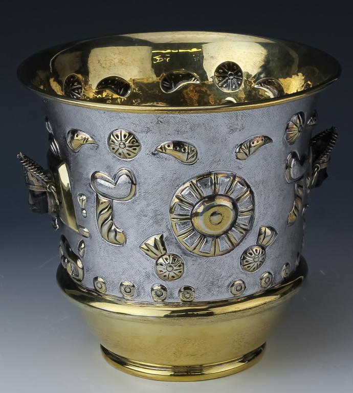 Tane Sterling Silver & Gold Aztec Mayan Onyx Vase: Stunning hand crafted artisan ice bucket / centerpiece vase by Tane Orfebres. Features elaborate ancient motifs with black onyx face. Embellished with gold vermeil highlights. Measures 8" x 8 1/4". Ma