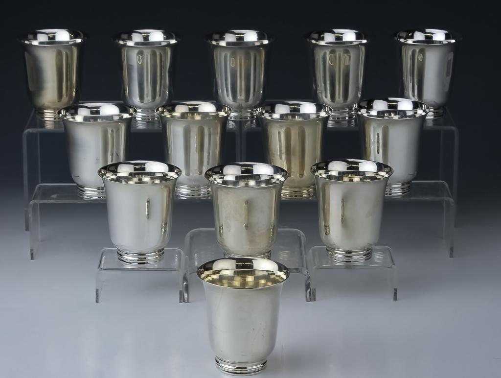 13 Mexican Sterling Silver Modernist Cups 1448gr: Fine artisan solid silver cocktail cups by Tane Orfebres, Mexico. Features a sleek body with ribbed circular foot. Measures 3" x 2 3/4". Marked Tane JMS with Eagle mark Mexico 0.925. Weighs 1448 grams