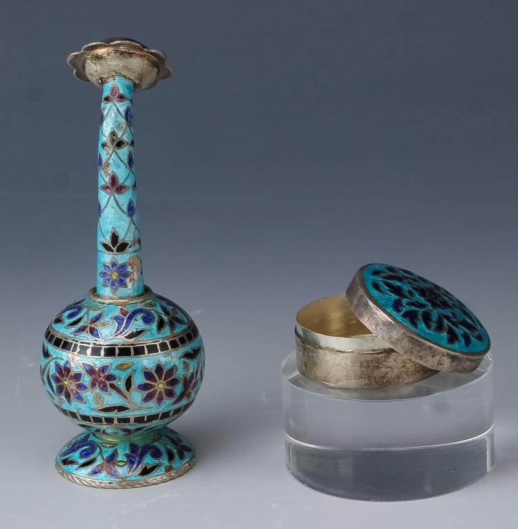Pair of Sterling Silver Enamel Box & Salt Shaker: Two sterling silver and enamel items. Features a floral form spice shaker measuring 4 1/4" x 1 1/2" with blue enamel decoration. Also comes with a 1 1/2" diameter lidded pill box with blue floral enam