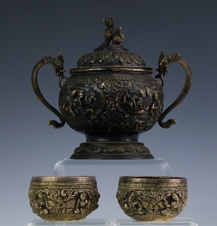 3 Piece Burma Silver 19th Century Lidded Pot Bowls: Antique three piece Burma silver group. All crafted of fine quality 95% silver. Features a lidded double dragon handled pot with foo dog finial. Figural scenes on the sides with floral borders. Two or