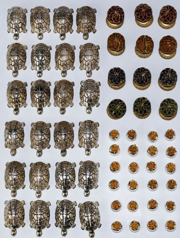 LOT of 56 Enamel & Silver Plate Place Card Holders: Lot of various place card holders. Features 12 Faberge egg style place card holders with enamel from the Metropolitan Museum of Art. 24 Silver plated pineapple form card holders from Saint Hilaire. La