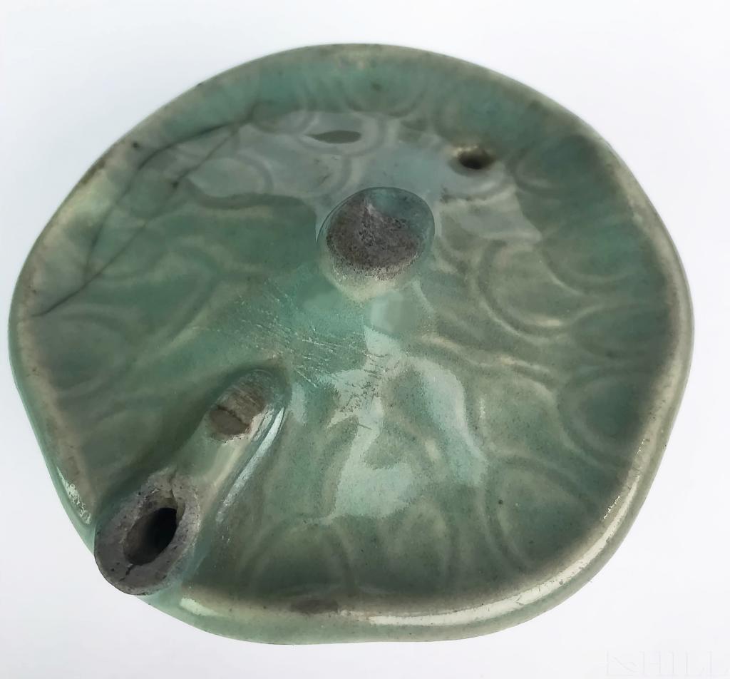 Early Korean Celadon Lily Pad Porcelain Dropper: Korean Water Dropper (Korean, 19th Century or earlier) Lily Pad form Water Dropper Polychrome Glaze over Porcelain. Measures: 1 3/8 in. x 3 in. Condition: Good condition For inquiries, condition repor
