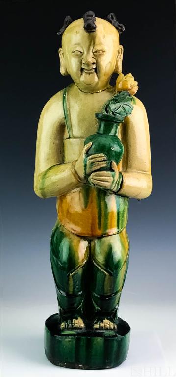 Antique 19th C Chinese Sancai Glazed Pottery Boy Statue: Antique Chinese Sancai Figure (Chinese, 19th Century or earlier) Green and Yellow Glazed Statue of A Boy with Potted Lotus Flower, Plant Ceramic Figure: 21 1/4 in. x 7 1/2 in. x 5 in. Condition: Fair 