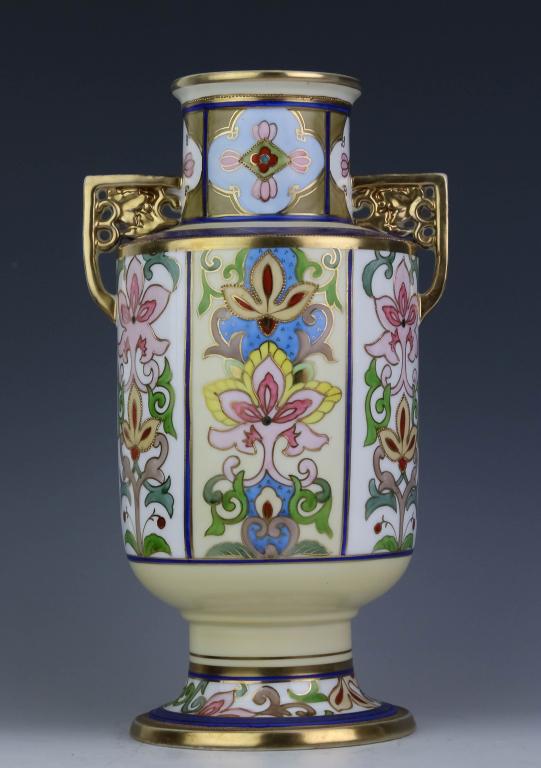 Hand Painted Japanese Nippon Reticulated Vase: Vintage Japanese hand painted Nippon vase. Features European styled floral polychrome decoration with raised gilt moriage outlines. The gold gilt handles are finely reticulated. Green Nippon mark on v
