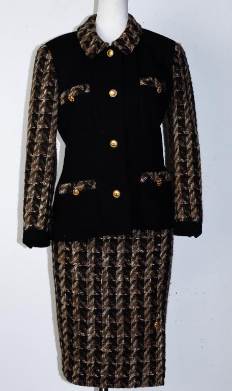 Ladies CHANEL Brown Black Plaid Jacket Skirt Suit: Authentic Chanel ladies suit. Black body jacket with tweed boucle sleeves and collar in brown beige and black hounds tooth pattern. Gold CC logo buttons with rope borders. Comes complete with matching