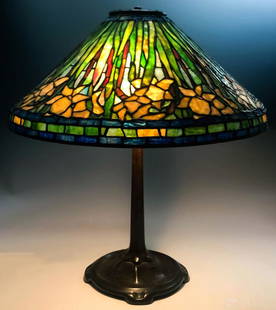 Tiffany Style Patinated Bronze Flower Desk Lamp: Tiffany Studios style white flower desk lamp. White, blue and light green leaded glass shade. Three bulb lamp. Good condition with normal age related wear. Measures 22 in. height x 20in. width. Hill A