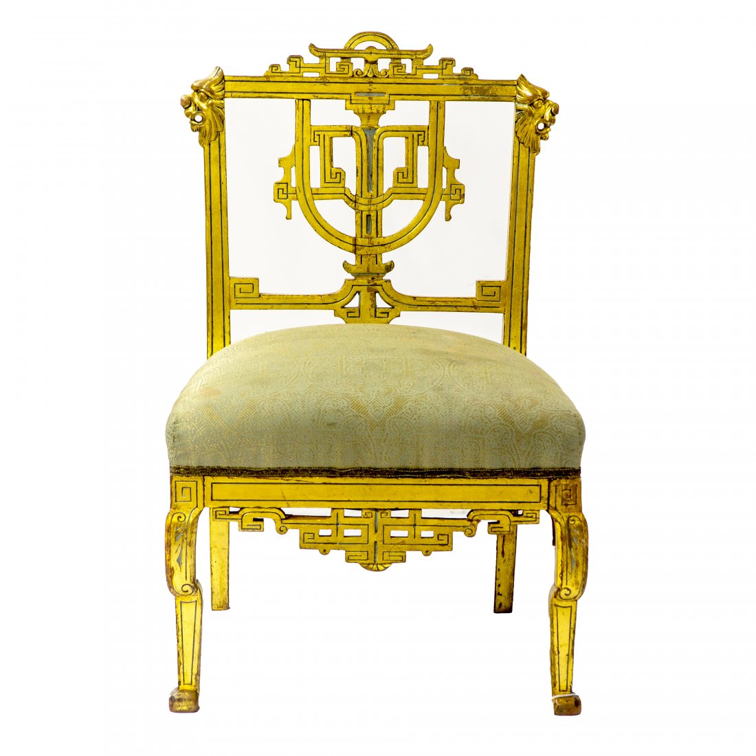 Herter Brothers Giltwood Decorated Slipper Chair: Antique late 19th century diminutive slipper chair in the Aesthetic taste attributed to Herter Brothers. Geometric and pierce carved crest flanked with figural carved mounts above an upholstered seat.