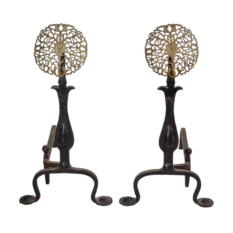 Pair Brass & Wrought Iron Arts & Crafts Andirons: English Arts & Crafts style andirons. Hand wrought iron with pierced brass "sunflowers" Each approximately 30 in. x 22 in. x 15 in. Good condition with mild surface wear, rust to metal, tarnish to bra