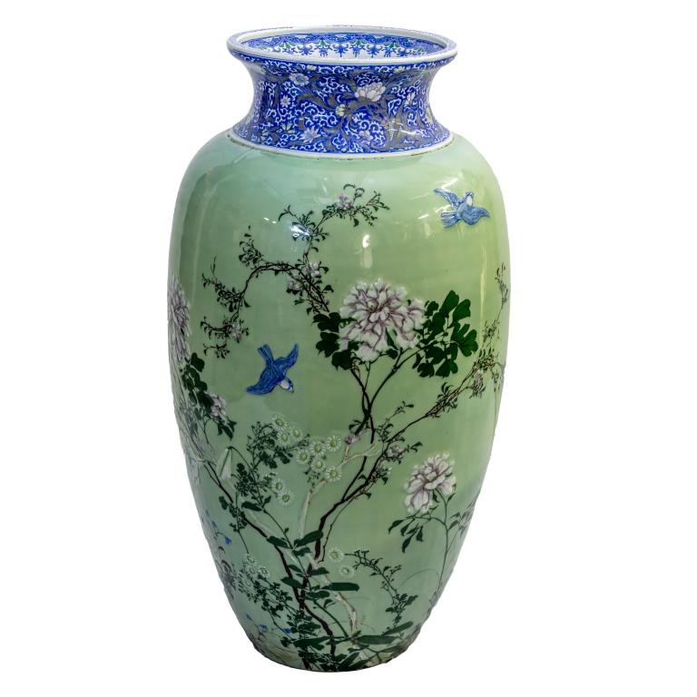 Important Japanese Celadon Porcelain Palace Vase: Antique Japanese Meiji period floor palace vase. Crafted of fine quality porcelain. Features bird and floral enameled design against a celadon glazed body. Flaring neck in blue and white with graceful