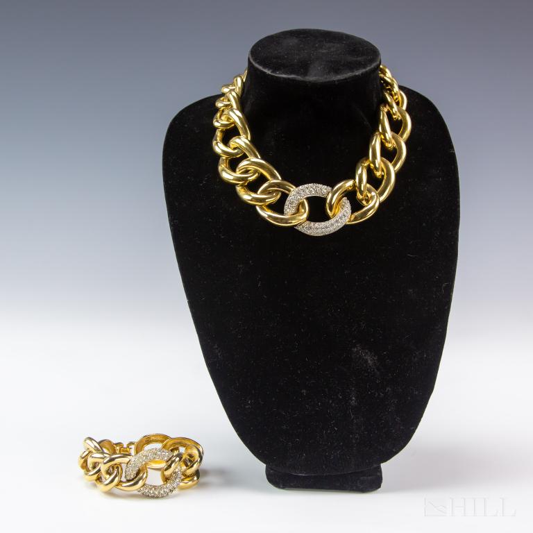 Givenchy Gold Tone Chain Link Necklace & Bracelet: Givenchy vintage gold toned and crystal chain link necklace and matching bracelet set. Each piece stamp signed. Necklace measures 17 in. x 2 in. Bracelet: 1 1/2 in. x 2 in. Condition is good, showing 