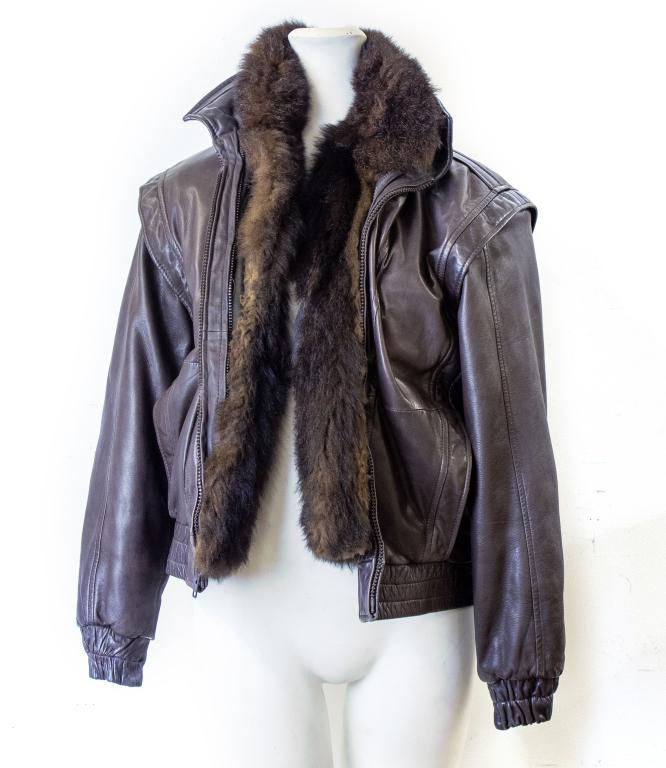 Vintage Brown Leather Bomber Jacket Fur Lining: Vintage brown leather bomber jacket with authentic brown fur lining. Size Medium. Jacket has two front zippers, two front pockets, one interior pocket, fur lining (like a vest), with collar. Approxima