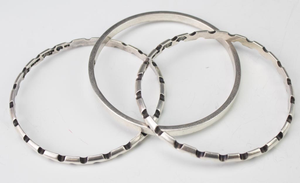 Antonio Pineda Mexican 970 Silver Bangle Bracelets: Rare set of three stacking bangle bracelets by famed Mexican silversmith Antonio Pineada. Marked Antonio Taxco Hecho En Mexico Silver 970 eagle 17. Weighs 60 grams. Size 8" inner measurement, 5mm wide