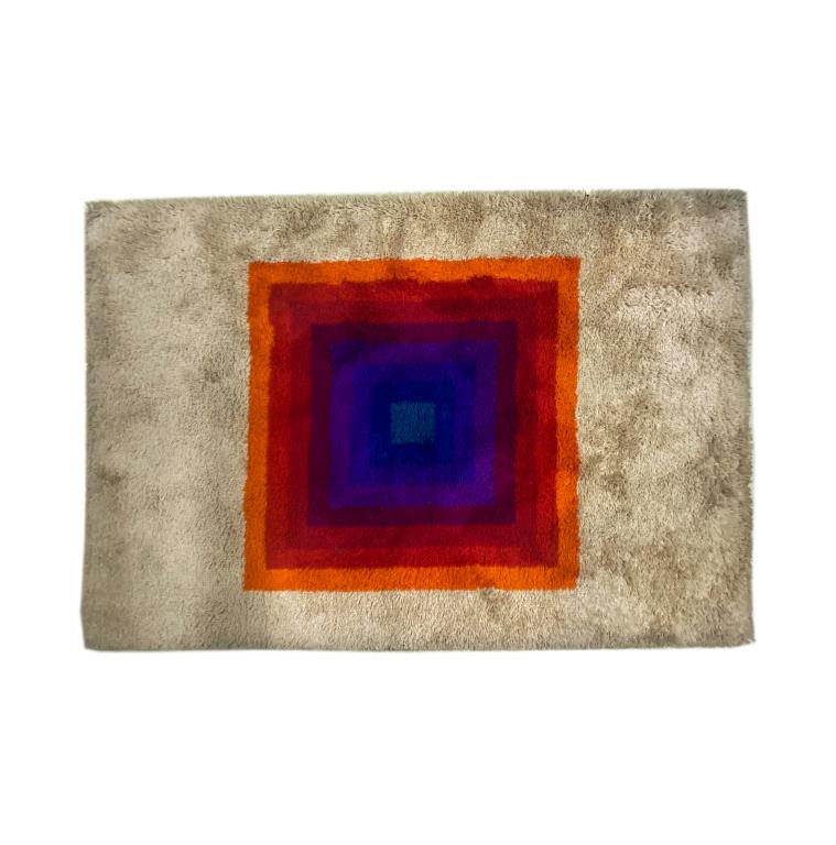 VTG Verner Panton Red Blue Square Shag Rug 77x54: Vintage shag area rug designed by Verner Panton (1926-1998 Danish) Rectangular shape rug with square design in red to orange to purple shades against a white background. Rug 77 in. x 54 in. Good condi