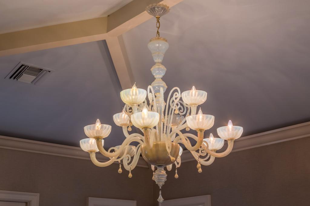 Murano Opalescent Art Glass 12 Arm Chandelier: Large and impressive Murano art glass chandelier. Crafted of opalescent white glass. Elegant design with 12 curved arms fitted with light fixtures. Measures approximately 53 in. x 44 in. Good conditio