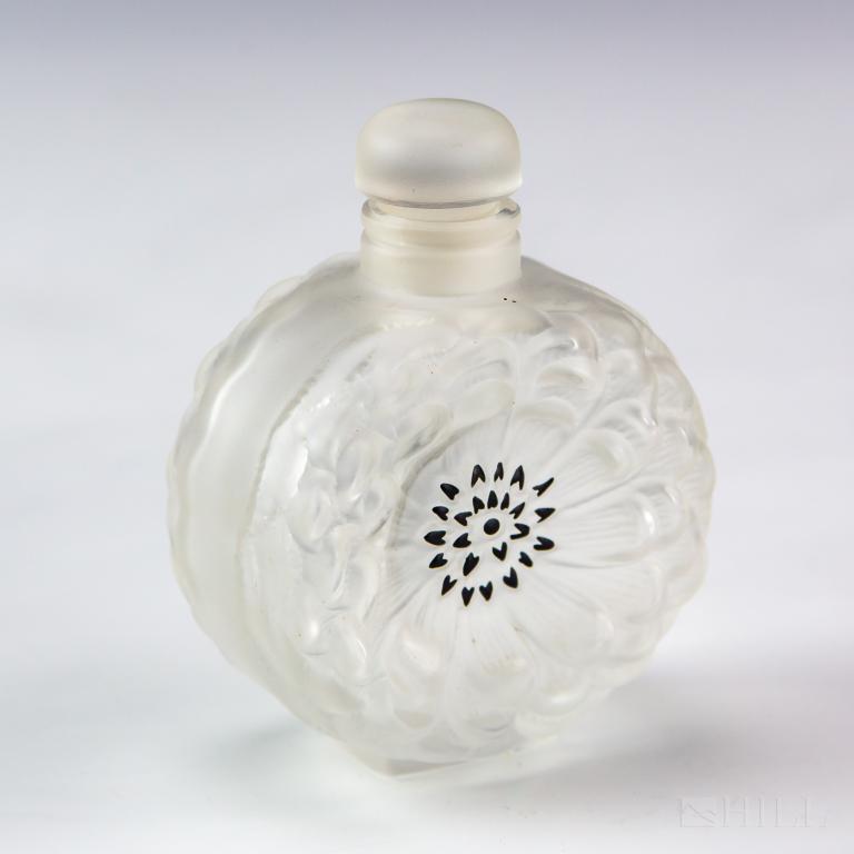 Lalique France Crystal Dahlia No 4 Perfume Bottle: Vintage Lalique crystal Dahlia No. 4 flower perfume bottle. Featuring frosted crystal floral body with black enamel accents. Underside of the bottle signed Lalique France. Bottle: 3 3/8 in. x 2 1/2 in