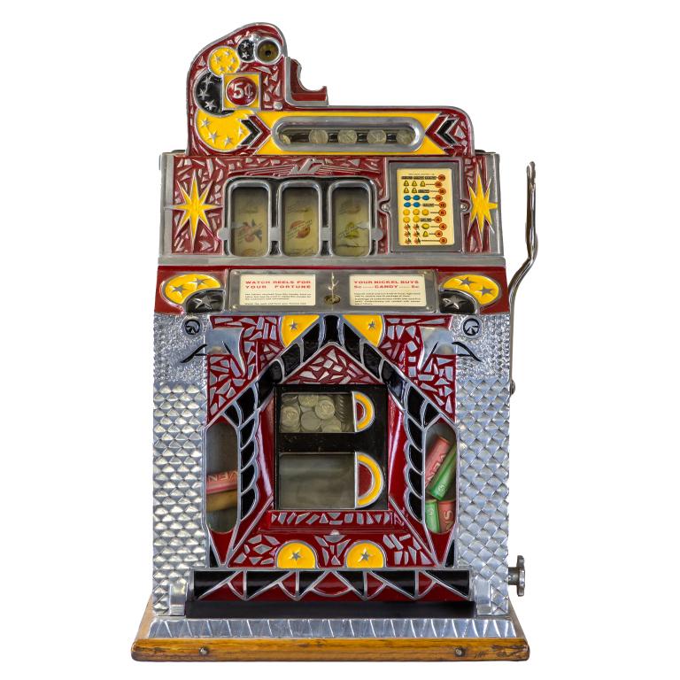 Vintage 1931 Mills Novelty Co 5 Cent Slot Machine: Vintage 1931 Mills Novelty Co " Silent Model" Coin Operated 5 cent Slot Machine. Machine is fixed on wood base. Front of machine with moon and star design painted in red, yellow and black, with wood s